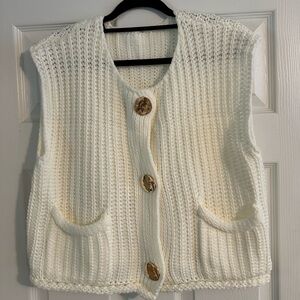Cream sweater vest with gold buttons